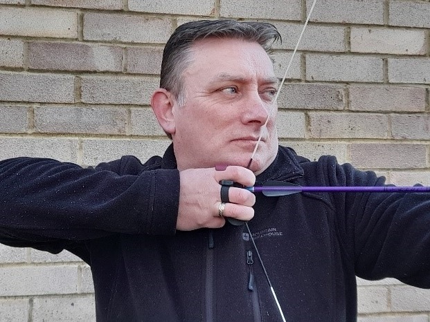 Peter Broadhurst shooting a bow